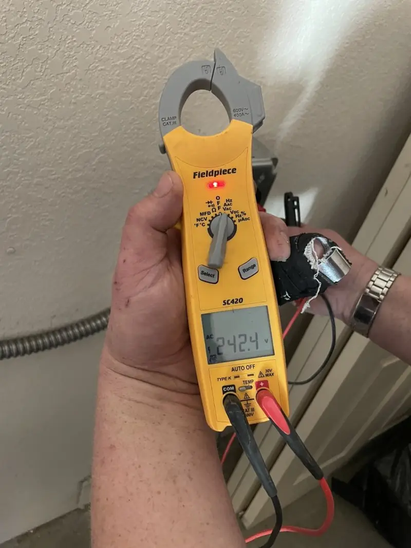 Voltage testing with clamp meter during Generator Installation in Douglass Hills